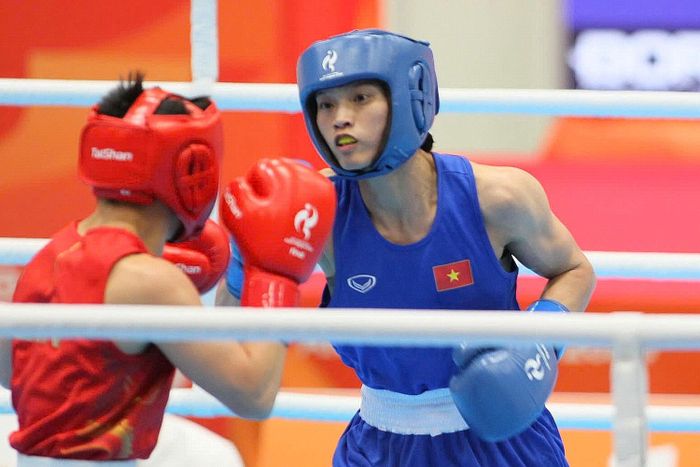 Từng viết đơn xin bỏ boxing, Nguyễn Thị Tâm sau đó kiên trì trở lại, từng bước vươn lên và dùng chính những thành quả từ võ đài để cải thiện cuộc sống gia đình. Ảnh: Bùi Lượng.