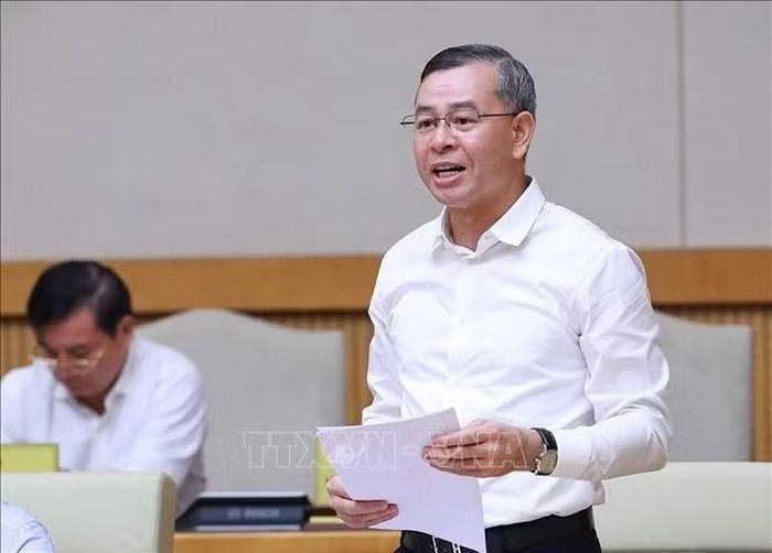Bộ trưởng Bộ Tài chính Ngô Văn Tuấn báo cáo tình hình kinh tế - xã hội tháng 9 và 9 tháng năm 2026. Ảnh: Dương Giang/TTXVN