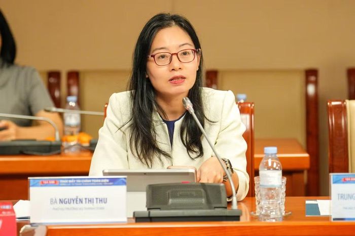 Bà Nguyễn Thị Thu - Phó Vụ trưởng Vụ Thanh toán, Ngân hàng Nhà nước phát biểu tại tọa đàm. (Ảnh: Vietnam+)