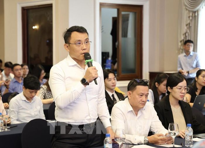 Đại diện doanh nghiệp nêu ý kiến tại Hội nghị. Ảnh: Xuân Anh - TTXVN