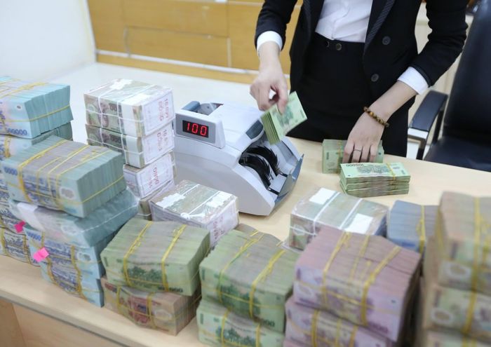 Nếu một phần các khoản vay có vấn đề tiếp tục chuyển thành nợ xấu, áp lực trích lập và lợi nhuận có thể gia tăng. Ảnh: BNEWS phát