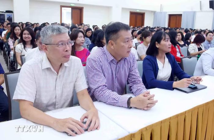Đảng viên thuộc Đảng bộ Thông tấn xã Việt Nam tham dự Hội nghị trực tuyến tại điểm cầu trụ sở Thông tấn Quốc gia (5 Lý Thường Kiệt, Hà Nội). (Ảnh: Phạm Kiên/TTXVN)