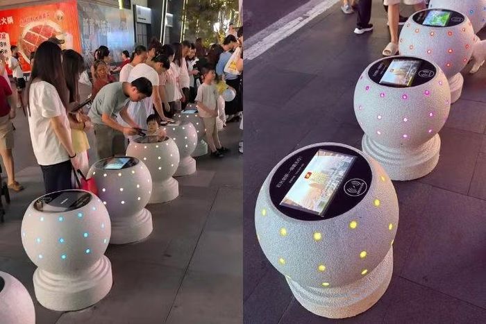 Trụ đá tích hợp bề mặt sạc không dây tại Thành Đô giúp người đi đường có thêm lựa chọn nạp pin điện thoại ở nơi công cộng. (Ảnh: i-meihua)