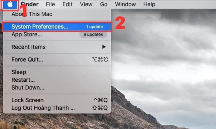 Nhấn vào menu Apple rồi chọn System Preferences.