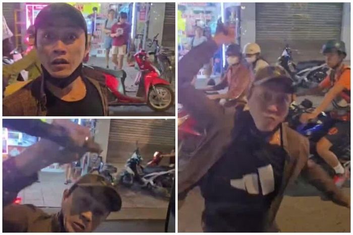 Người đàn ông với thái độ hung hãn, cầm gậy gỗ đập vỡ kính xe tải. Ảnh: Cắt từ clip.