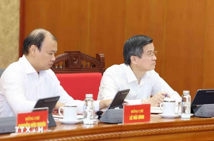 Lãnh đạo Học viện Chính trị Quốc gia Hồ Chí Minh tham dự buổi làm việc. (Ảnh: Phương Hoa/TTXVN)