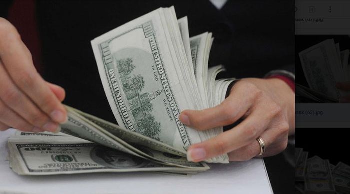 Áp lực tỷ giá cũng là một vấn đề khi giảm lãi suất VND. Ảnh: HH