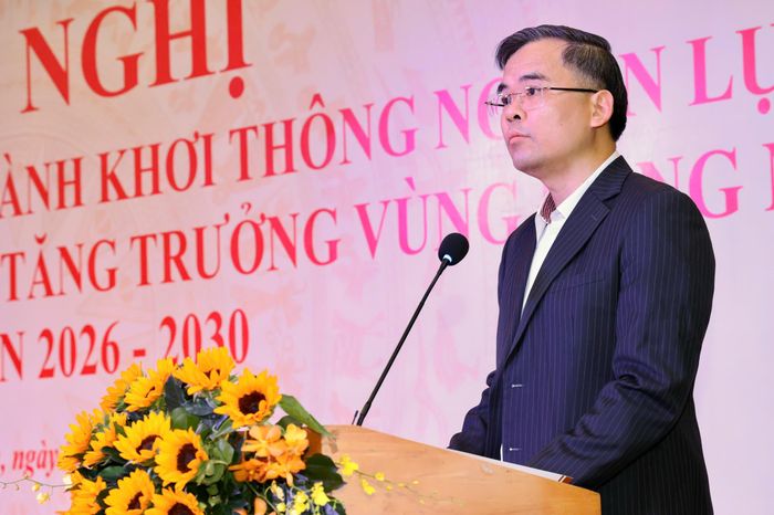 Ông Nguyễn Xuân Bắc, Phó Vụ trưởng Vụ Tín dụng phát biểu tại hội nghị. Ảnh: HOÀNG TRIỀU