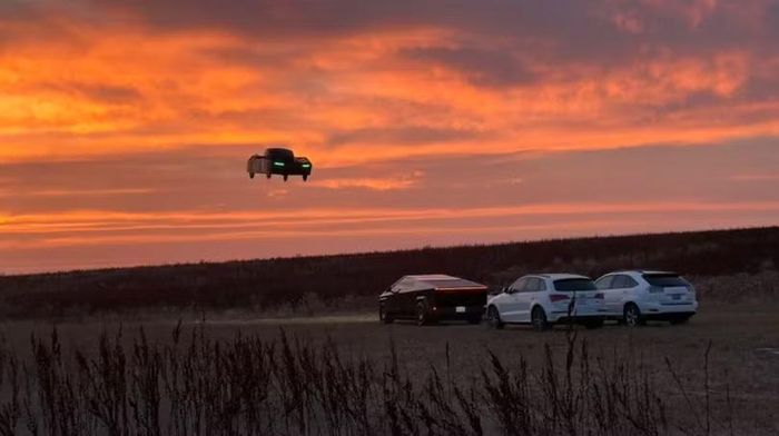 Một chiếc xe Alef bay lượn phía trên những chiếc ô tô, trong đó có một chiếc Tesla Roadster và một chiếc Cybertruck. Ảnh: Alef.