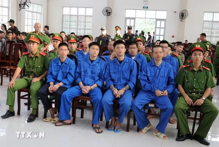 Các bị cáo tại phiên tòa. (Ảnh: Hữu Chí/TTXVN)